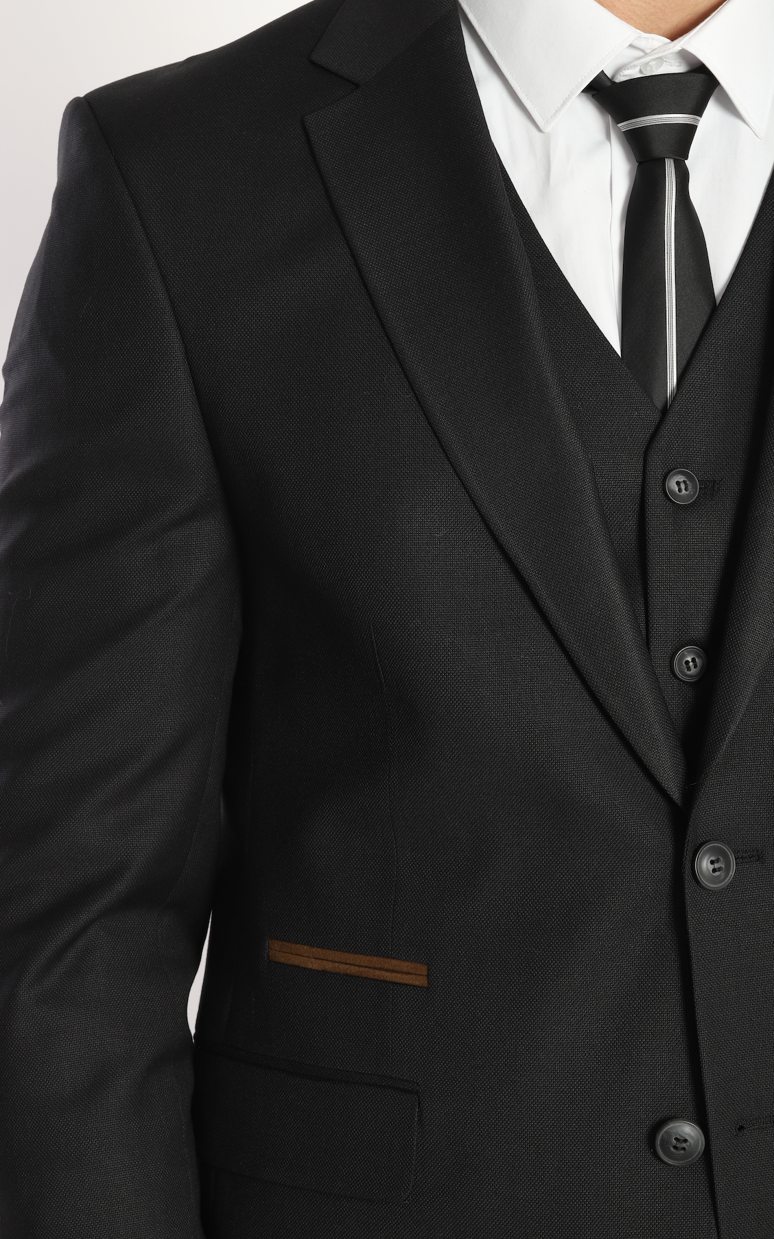 Black three piece suits by designer