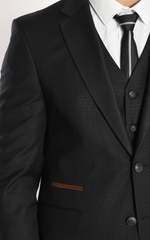 Black three piece suits by designer