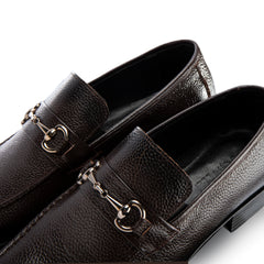 Brown leather loafers with decorative metal accents