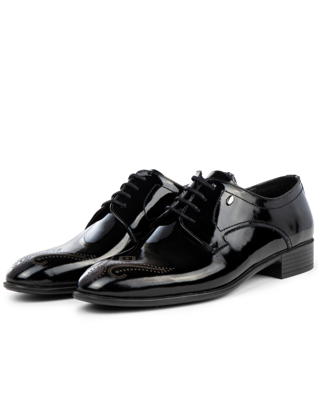 Pair of black patent leather dress shoes on a white background